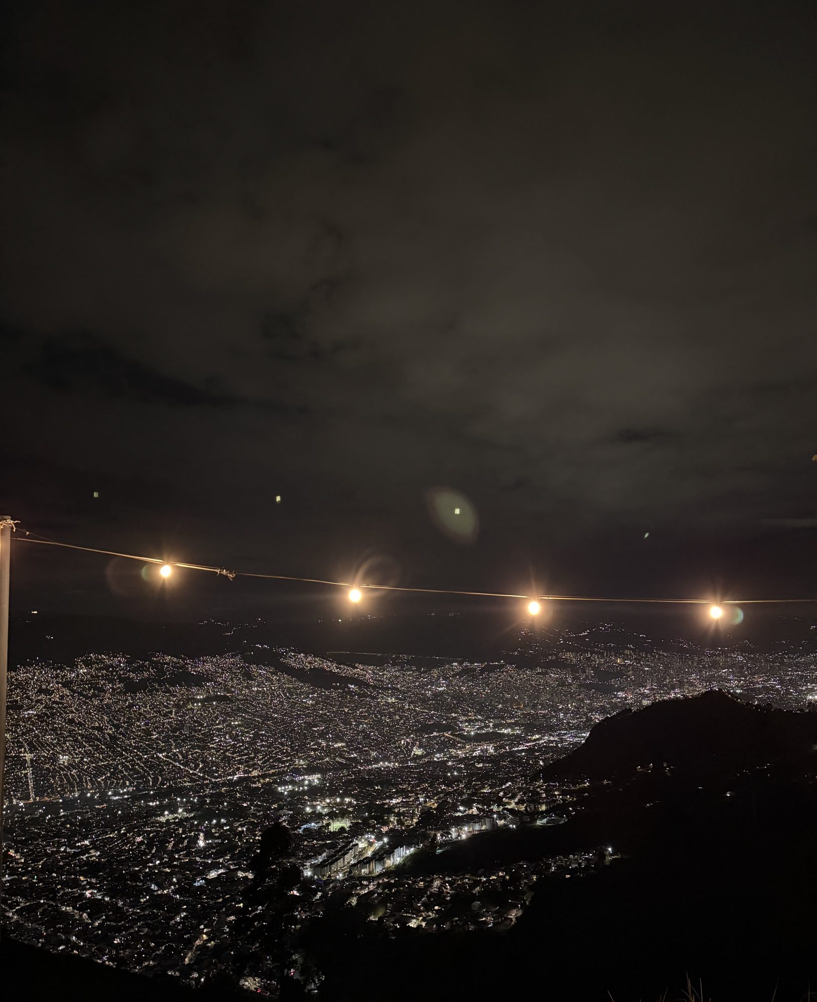Medellín city lights at night from a lookout