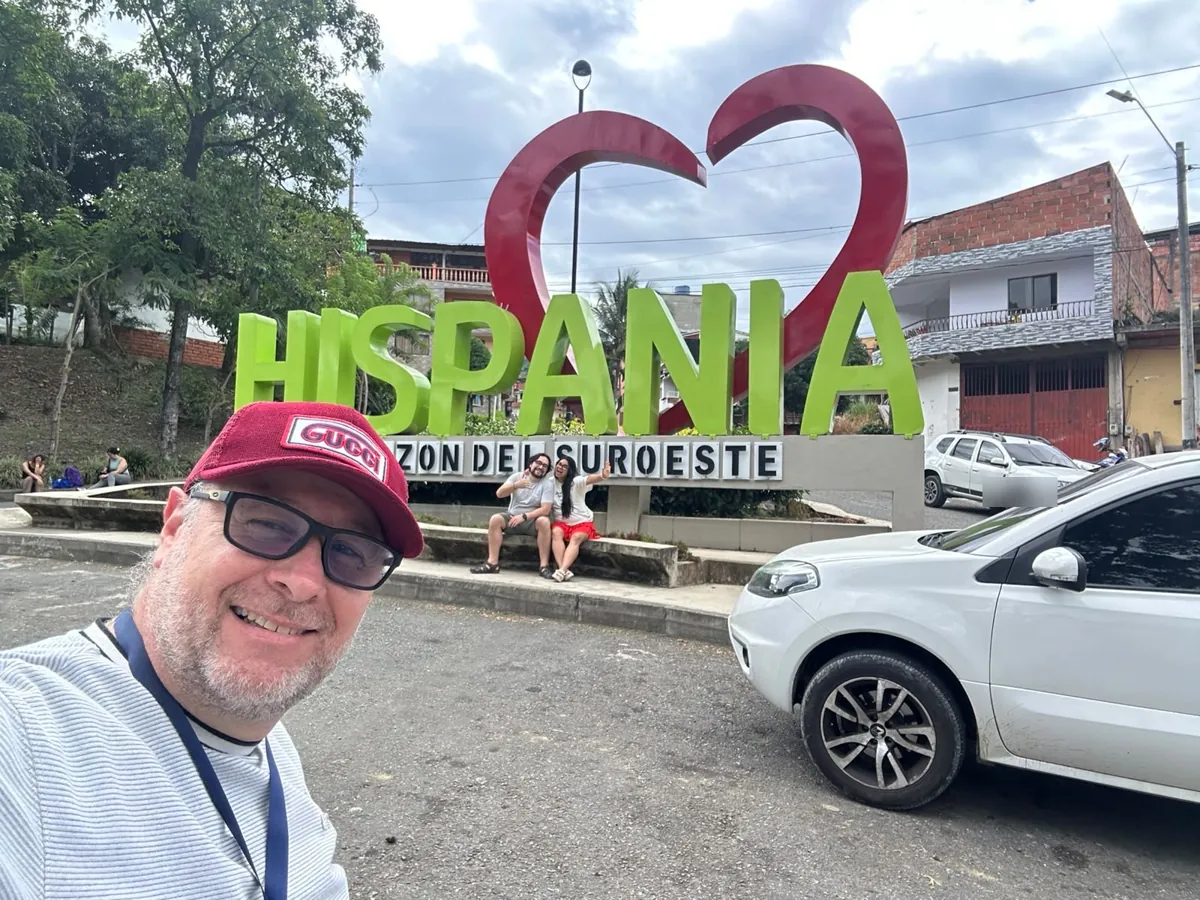 Hispania, in Antioquia’s southwest, on a real day trip Juan with travelers at the Hispania town sign, Suroeste antioqueño